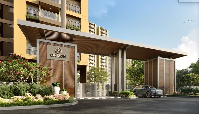 Srijan Orizon towers at dusk along the approach road